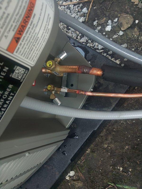 Completed warranty replacement of defective outdoor condensing unit. Removed failed condenser, installed replacement unit, reconnected refrigerant lines and electrical connections, pressure tested system, and verified proper operation with manifold gauges showing appropriate pressures and temperatures. Transported original defective unit back to shop per warranty protocol.