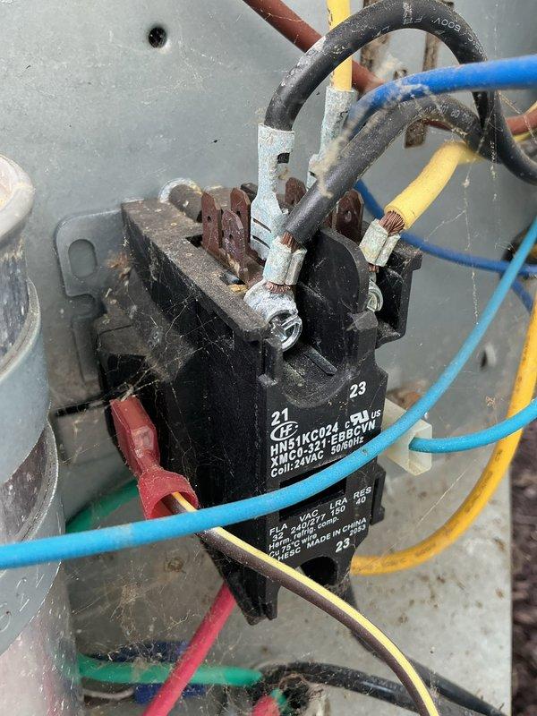 Performed comprehensive tune-up on 2-year-old residential air conditioning system with no reported operational issues. Inspected outdoor condenser unit, verified proper electrical connections at contactor assembly, and documented equipment condition through photographic records. All components found operating within normal parameters; system tested and confirmed functioning properly for continued seasonal use.