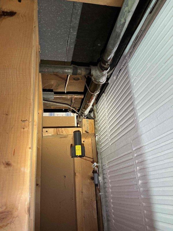 Conducted comprehensive electrical assessment for Generac generator installation in response to frequent power outages affecting the property. Evaluated existing electrical infrastructure including main service panel with dual columns of circuit breakers and basement utility area containing mechanical systems, plumbing, and ductwork. Documented current electrical configuration, panel capacity, and available space for generator transfer switch integration to provide backup power solution during utility interruptions.