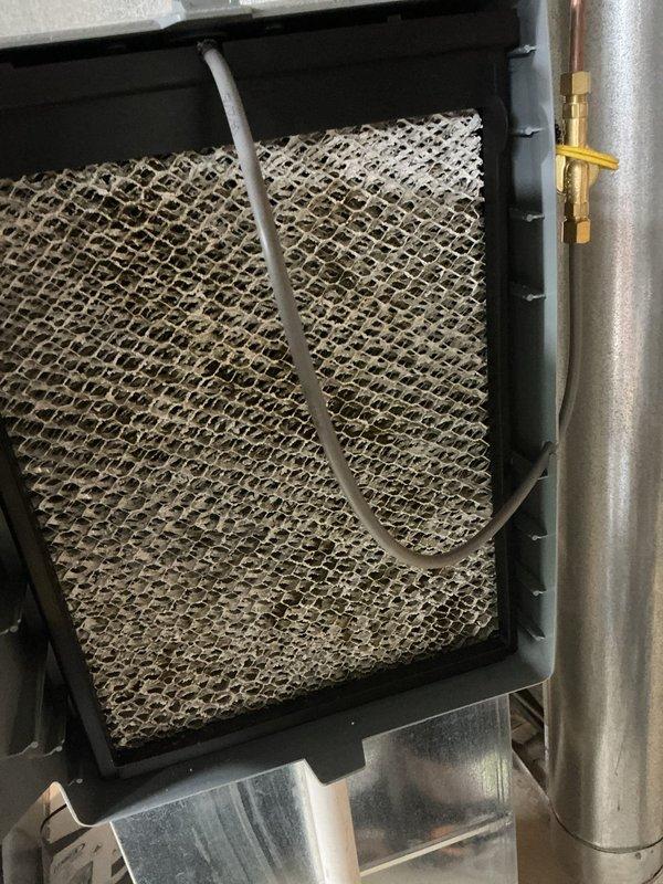Completed MVP preventive maintenance cooling visit on residential air conditioning system. Inspected outdoor condenser unit, which showed normal operational wear with intact protective grilles and cabinet. The evaporator coil filter was found heavily clogged with dust and debris accumulation, restricting airflow to the system. Cleaned filter thoroughly to restore proper air circulation and system efficiency. Verified refrigerant lines, electrical connections, and condensate drainage components were functioning correctly. Unit returned to optimal operating condition.