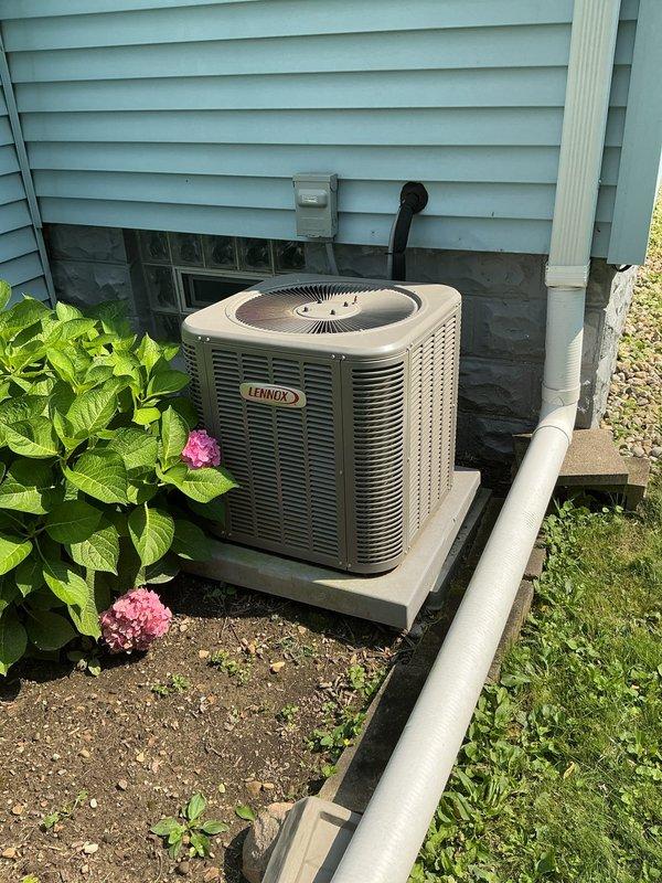 Completed MVP cooling maintenance visit on 4-year-old Lennox air conditioning system. Performed comprehensive inspection of outdoor condensing unit and indoor furnace components, verified proper operation of all equipment, checked refrigerant levels and electrical connections, and documented system condition with photos showing unit properly positioned on concrete pad with adequate clearance and landscaping maintenance around perimeter.
