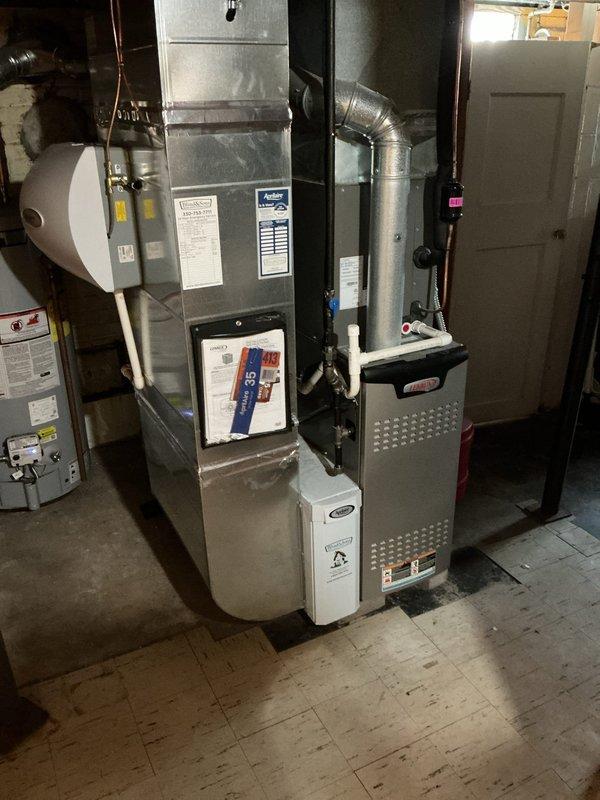 Completed MVP cooling maintenance visit on 4-year-old Lennox air conditioning system. Performed comprehensive inspection of outdoor condensing unit and indoor furnace components, verified proper operation of all equipment, checked refrigerant levels and electrical connections, and documented system condition with photos showing unit properly positioned on concrete pad with adequate clearance and landscaping maintenance around perimeter.
