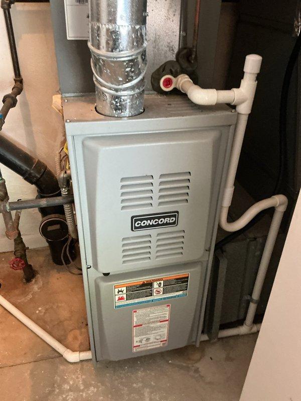 Completed MVP cooling maintenance visit on residential HVAC system. Performed comprehensive inspection of Concord furnace unit and associated components including air handler, ductwork, condensate drainage system, and thermostat controls. Documented equipment condition through photographic records showing all major system components operating within normal parameters. All safety labels and manufacturer specifications verified as present and legible on unit.