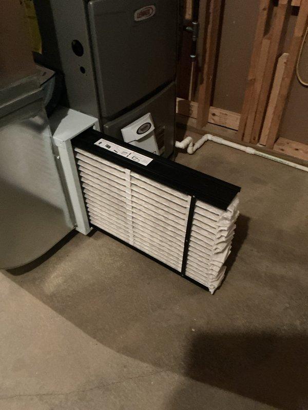 Completed BS-MVP cooling maintenance visit on residential HVAC system. Inspected and verified air filtration system with clean accordion-style filters properly installed in housing unit. Performed diagnostic temperature measurements on system components, recording supply air temperature of 45°F which indicates proper cooling operation and refrigerant charge levels within acceptable parameters.