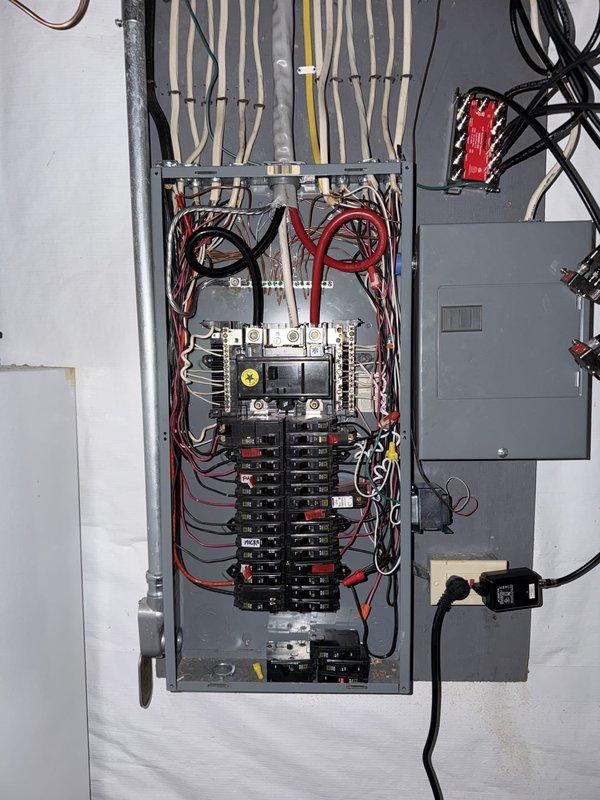 Completed installation of 22kW standby generator with oil warmer system at residential property. Installed 150-amp automatic transfer switch with proper panel integration and wiring connections. Ran 30 feet of gas line from existing service point to generator location and completed all electrical connections from transfer switch to generator unit. Coordinated with gas line contractor for natural gas supply installation. All components tested and verified operational upon completion.