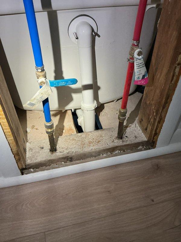 Responded to emergency plumbing service call at 74-year-old residential property with severely rusted and leaking hot water heater tank requiring immediate replacement. Removed failed water heater unit and installed new tanked water heater system with proper connections to existing hot and cold water supply lines using PEX piping with appropriate fittings and shut-off valves. Installed code-compliant PVC drain/vent piping system with proper mounting brackets and securing hardware to wooden framing. Additionally addressed critical shower fixture failure where valve assembly had detached from wall, requiring reinstallation and securing of shower control and delivery system. Tested all connections for leaks, verified proper water pressure and temperature at shower fixture, and confirmed full system functionality upon completion.