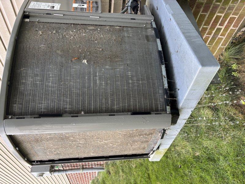 Completed MVP cooling maintenance visit on 3-year-old system. Performed comprehensive inspection of outdoor condensing unit, removed top panel to access internal components, and assessed condenser coil condition. Coils showed significant accumulation of dirt, debris, and dust requiring attention. Documented equipment condition with photos showing both internal coil assembly and external unit positioning. Unit remains operational with all components intact. Confirmed appointment and completed scheduled recurring maintenance service.