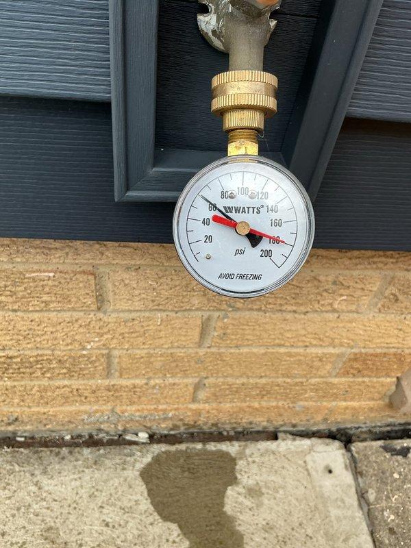 Responded to complaint of knocking noise in copper pipes occurring when shower and sink fixtures were operated in 1960s-era home. Tested static water pressure at exterior hose bib using calibrated gauge, recording reading of approximately 60-80 PSI. Inspected accessible plumbing lines and HVAC ductwork in attic space to identify potential water hammer issues and verify proper pipe securing. Documented conditions with photos for further assessment and recommendation of water hammer arrestor installation or pressure reduction if needed.