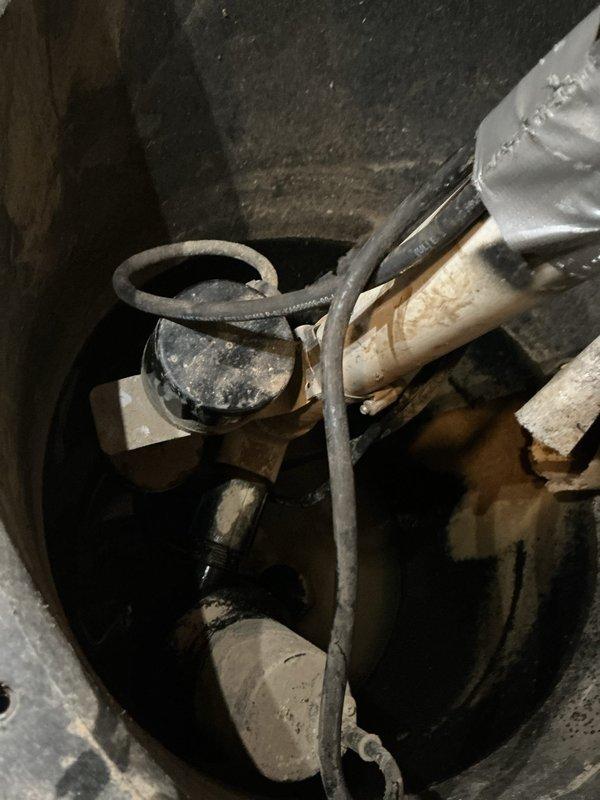Responded to service call for sump pump system experiencing continuous audible alarm with unknown operational status. Upon arrival, performed comprehensive diagnostic evaluation of the sump pump assembly installed in basement basin. Inspection revealed pump mechanism, float switch assembly, and discharge piping configuration. Utilized diagnostic testing equipment to assess electrical components, pump motor functionality, and alarm system operation. Identified source of persistent beeping alarm and evaluated overall system performance including basin water level monitoring, float switch positioning, and pump cycling capabilities. Documented existing conditions through photographic evidence showing sump basin installation, pump components, PVC discharge lines, and associated mechanical systems. Presented diagnostic findings and repair options to customer for consideration.
