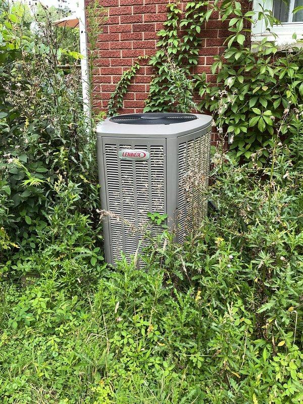 # HVAC Maintenance - Cooling

Completed routine preventive maintenance visit on a 9-year-old Lennox air conditioning system for an MVP customer. Performed comprehensive inspection of both indoor furnace unit and outdoor condensing unit, documenting equipment condition through photographic records. Outdoor unit showed adequate operational status despite vegetation encroachment around base and sides, which was noted for customer awareness regarding airflow and accessibility considerations.

Inspected indoor mechanical room installation including integrated HVAC system with vertical furnace, Renuaire tankless water heater, PVC ventilation piping, and condensate pump assembly. Verified proper operation of all system components and connections. All equipment appeared to be functioning within normal parameters with no immediate service concerns identified during this maintenance visit.