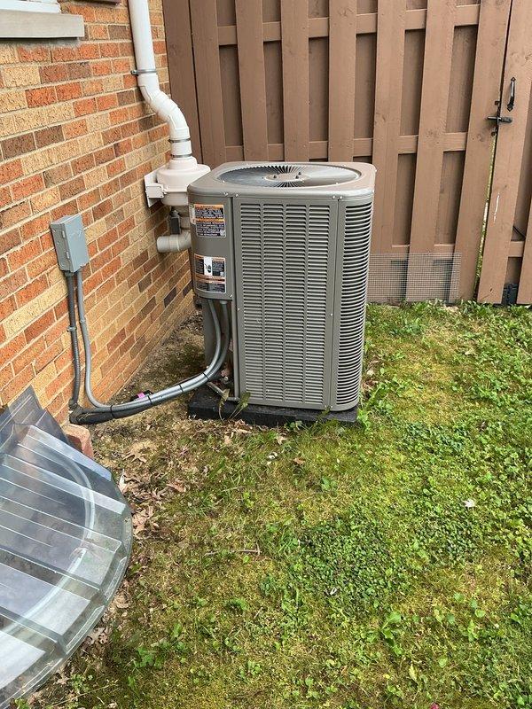 Completed preventive maintenance inspection on residential split-system air conditioning unit. Performed comprehensive visual inspection of outdoor condensing unit, verified proper electrical connections at disconnect box, and documented system condition through photographic records. All components operating within normal parameters with no deficiencies noted at time of service.