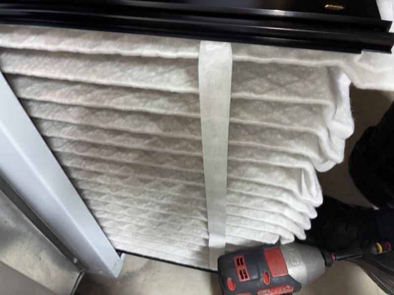 Completed MVP cooling maintenance visit on basement HVAC system. Replaced pleated air filter in air handler unit and inspected evaporator coil assembly, which showed normal dust accumulation on aluminum fins. Verified condensate drainage system with white PVC piping was intact and properly secured with mounting brackets, all components operating within normal parameters.