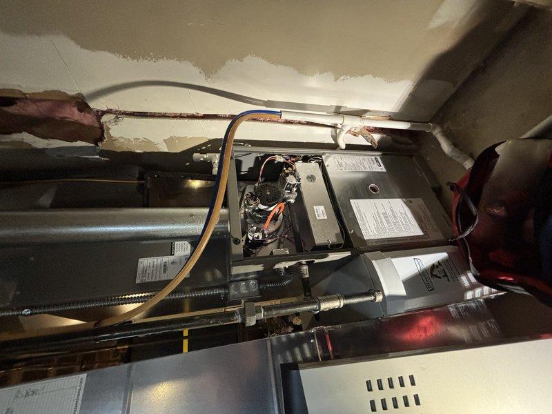 Completed comprehensive AC maintenance on residential cooling system. Performed inspection of air handler unit including internal components, electrical connections, and refrigerant lines. Checked and documented air filter condition in filter housing with proper airflow direction indicated. All mechanical and electrical components found to be operating within normal parameters at time of service.