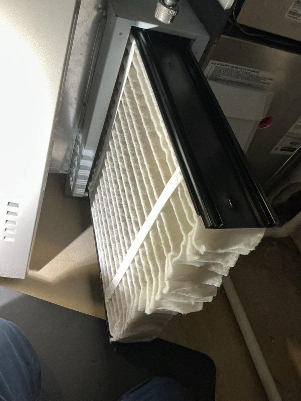 Completed comprehensive AC maintenance on residential cooling system. Performed inspection of air handler unit including internal components, electrical connections, and refrigerant lines. Checked and documented air filter condition in filter housing with proper airflow direction indicated. All mechanical and electrical components found to be operating within normal parameters at time of service.