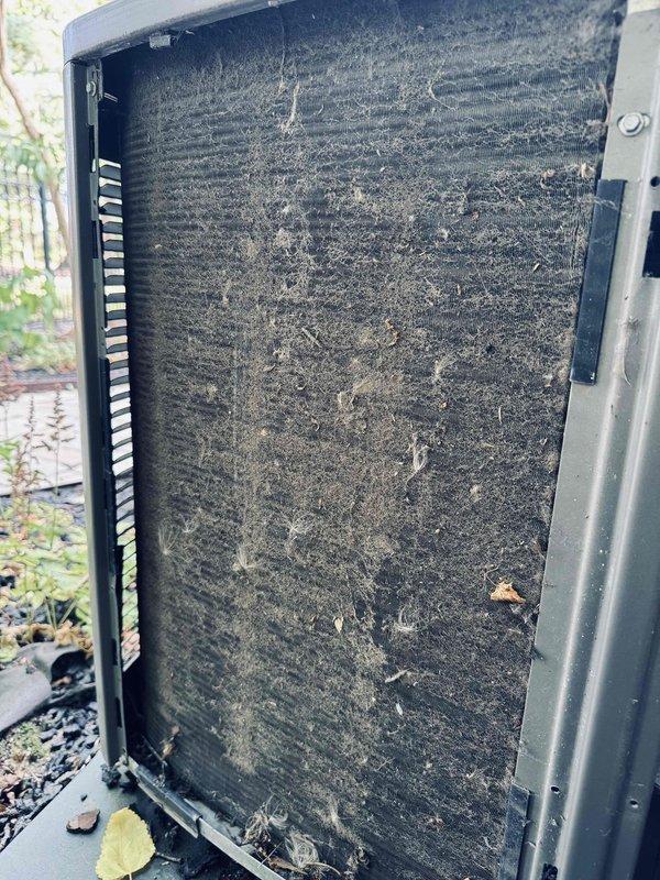 Responded to no cooling call on 4-year-old attic air conditioning unit. Upon inspection, found outdoor condenser coil heavily contaminated with dirt, dust, and debris accumulation, significantly restricting airflow and reducing heat transfer efficiency. Measured system operating pressures and confirmed elevated head pressure due to restricted condenser airflow. Diagnosed dirty condenser coil as primary cause of cooling failure and recommended thorough coil cleaning to restore proper system operation.