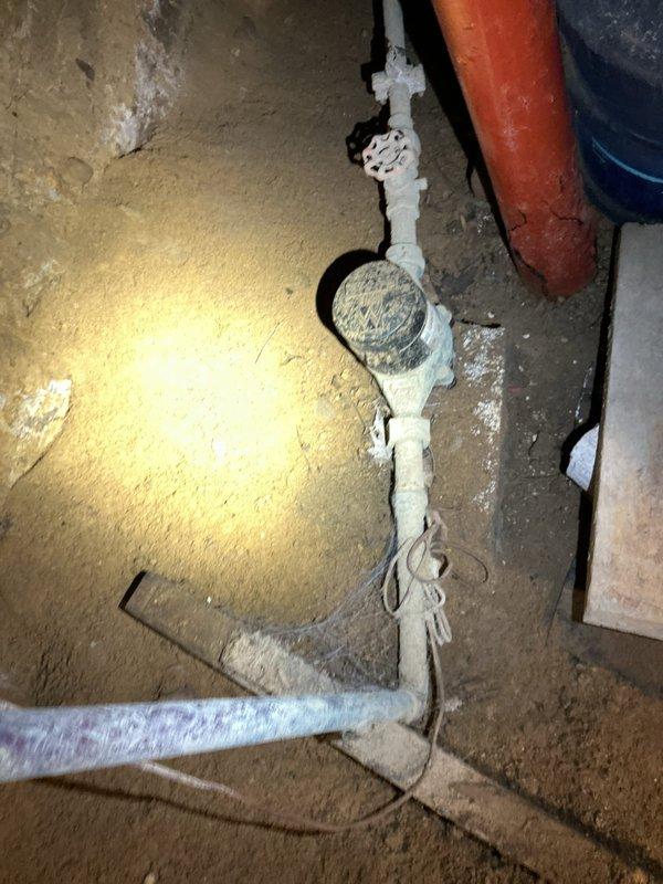 Conducted on-site assessment of existing gas water heater installation in basement of 1920s-era residential property to provide replacement estimate for 40-gallon gas unit. Inspected current water heater configuration, including gas supply connections, copper water piping, venting system, and existing drain pan setup. Documented existing plumbing infrastructure, noting basement access conditions, clearance requirements, and connection points for new installation. Evaluated gas line adequacy, flue venting pathway, and code compliance considerations for vintage home construction. Photographed current water heater condition, plumbing connections, pressure relief valve discharge piping, and surrounding utility space to support accurate material and labor estimate preparation.