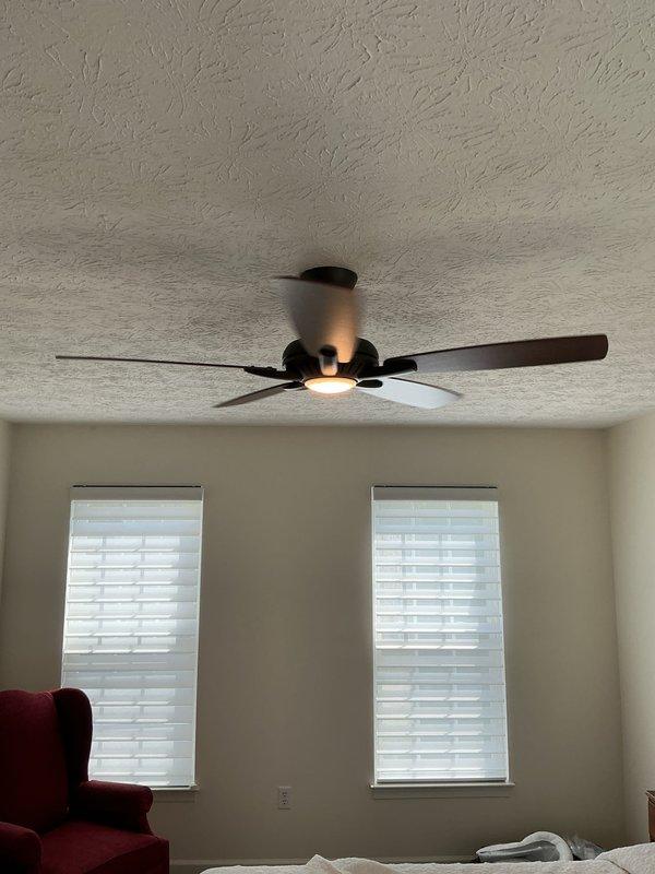 Installed two customer-supplied ceiling fans after replacing non-rated fiber ceiling boxes with fan-rated junction boxes secured to joists—one location accessed via attic, the other completed from below with minimal drywall disturbance. Additionally replaced a three-way dimmer switch in the dining room to complete the electrical upgrades.