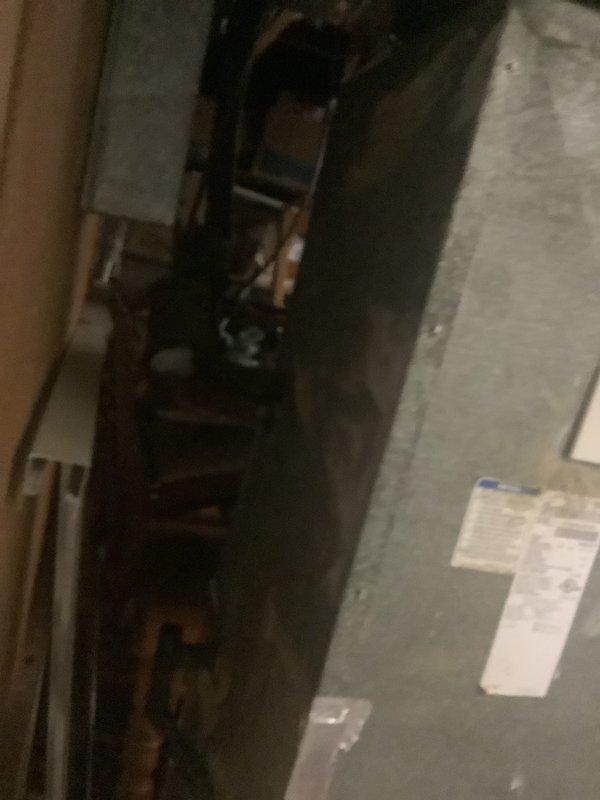 Conducted air conditioning replacement estimate for a 20-year-old system with existing Carrier furnace installation. Documented current HVAC equipment configuration including furnace unit with PVC venting and ductwork connections in basement utility area. Provided quote for replacement system to customer.