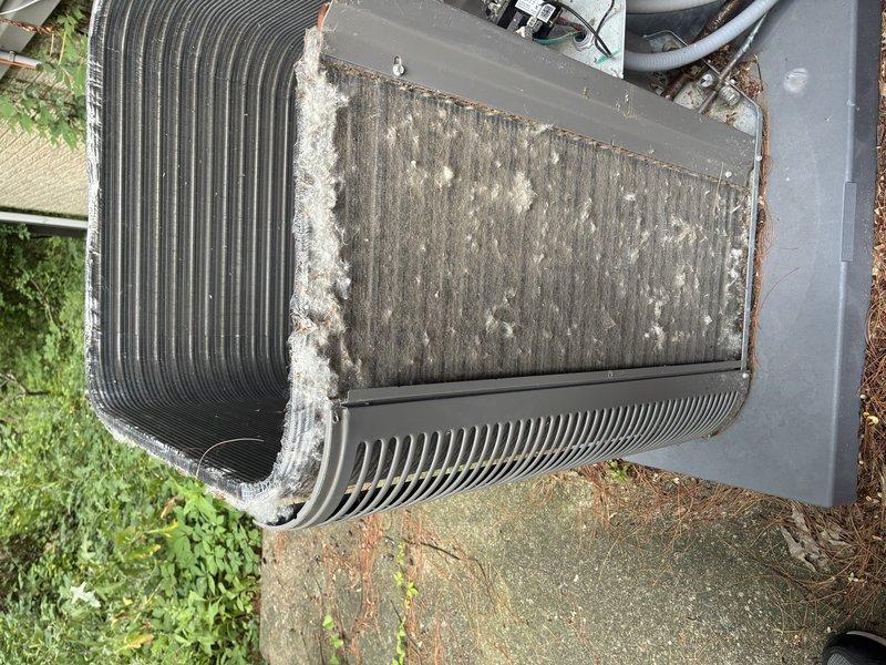 Completed preventative maintenance visit on a 5-year-old air conditioning system. Inspected outdoor condenser unit and found significant accumulation of dirt, dust, and debris on coil surfaces and filter panel, which was restricting airflow and reducing system efficiency. Examined evaporator coil and internal components, noting normal operational wear consistent with the unit's age. All refrigerant lines, connections, and ductwork were inspected and found to be in functional condition with proper insulation intact.