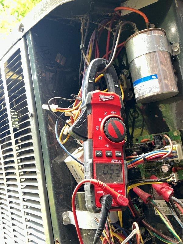 Completed comprehensive cooling maintenance and tune-up on residential air conditioning system. Performed visual inspection of outdoor condensing unit, verifying proper operation of all components including compressor, condenser fan motor, and electrical connections. Utilized digital multimeter to test capacitor functionality and verify proper voltage readings across all electrical circuits. Inspected refrigerant warning labels and confirmed proper refrigerant type and charge specifications. System operating within normal parameters with no deficiencies noted at time of service.