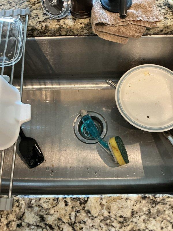 Responded to service call for leaking garbage disposal unit. Upon inspection, found active leak at disposal mounting assembly beneath kitchen sink. Per customer request, bypassed and removed the garbage disposal system, then reconfigured drain plumbing with direct connection from sink basin to existing P-trap assembly using appropriate PVC fittings. Tested drain flow and verified no leaks present in modified configuration. System restored to full operation without garbage disposal unit.