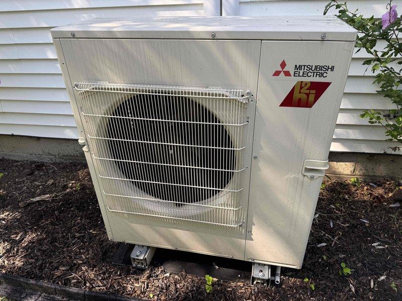 Completed routine maintenance inspection on one-year-old Mitsubishi Electric ductless mini-split system. Verified proper operation of indoor wall-mounted evaporator unit and outdoor condensing unit, confirmed system functionality, and documented equipment condition with photos for service records.