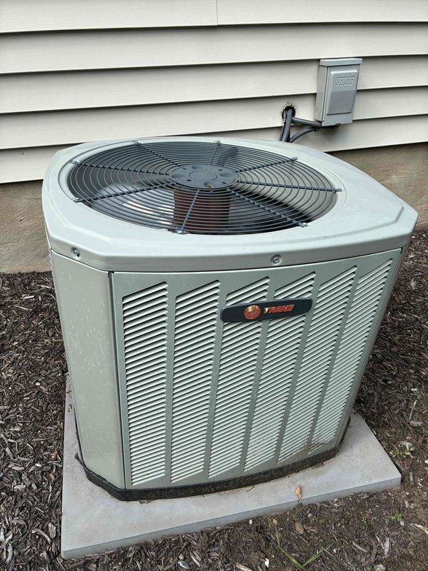 Completed scheduled BS-MVP cooling maintenance visit on a 12-year-old Trane air conditioning system during afternoon hours per customer availability. Performed comprehensive inspection of outdoor condensing unit and evaporator coil assembly, documenting conditions with photographic evidence. Notable findings included frost and ice accumulation on multiple sections of the evaporator coil fins, indicating potential refrigerant flow restrictions or airflow deficiencies. Observed signs of normal aging on copper refrigerant lines with surface oxidation and patina development. Exterior condensing unit showed typical weathering with dirt accumulation on cabinet surfaces but remained structurally sound on concrete pad. All standard preventive maintenance tasks completed according to protocol specifications.