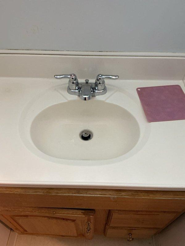 Successfully replaced existing bathroom faucet with new Moen dual-handle faucet assembly, including installation of pop-up drain assembly. Removed old fixture, installed new faucet with chrome finish and lever handles, connected water supply lines, and completed pop-up drain mechanism installation with proper sealing. Tested all components for proper operation and verified no leaks at connections or drain assembly.