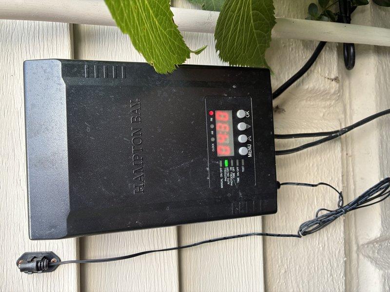 Responded to callback for non-functioning landscape lighting system previously installed by our company. Upon arrival, inspected Hamilton BLR control unit mounted on exterior fence and verified power supply and timer programming. Tested outdoor wall-mounted brass light fixture with active illumination and confirmed proper operation of compact fluorescent bulb. Troubleshot wiring connections at both the control panel and fixture locations, ensuring secure terminations and proper circuit continuity throughout the landscape lighting system.