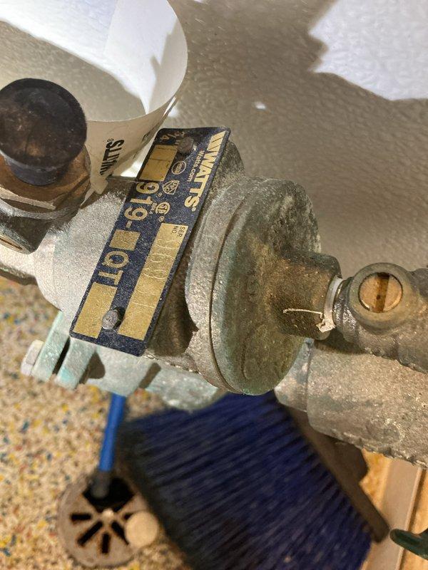 Completed backflow prevention device inspection and testing at commercial kitchen facility. Tested backflow assembly with brass fittings and shut-off valves, verifying proper operation of check valves and relief valve per local plumbing code requirements. All components passed inspection with acceptable pressure differential readings. Documented existing copper pipe configuration and valve conditions with photographic evidence for compliance records.