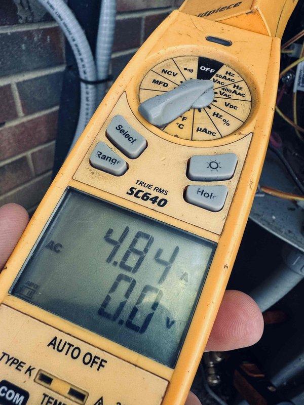 Performed comprehensive cooling tune-up on 6-year-old HVAC system. Inspected and tested dual run capacitor, which showed signs of age with surface oxidation on mounting hardware; verified electrical connections and measured voltage readings at 484V using digital multimeter to ensure proper system operation. All components functioning within normal parameters upon completion of preventive maintenance service.