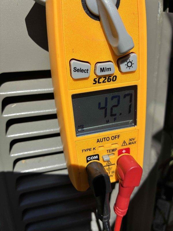 Completed MVP recurring cooling maintenance visit on 4-year-old system. Inspected outdoor unit and found both air filters heavily clogged with dust, dirt, and debris accumulation, restricting airflow. Measured system temperature at 42.7°F using digital multimeter at evaporator coil. Documented filter condition and operational readings for maintenance records.