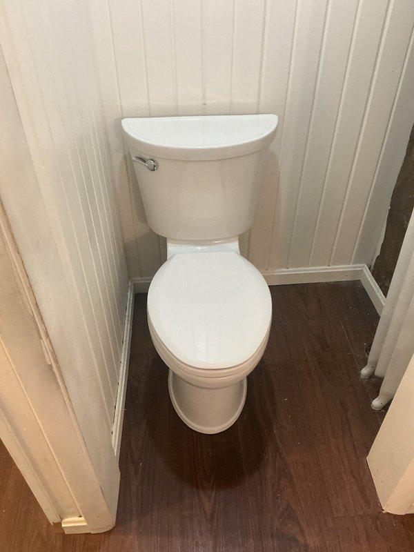 Removed existing toilet and installed new American Standard Champion right height elongated toilet with slow close seat. Replaced existing angle stop with new straight stop valve and connected supply line. Tested flush operation and checked all connections for leaks to ensure proper functionality.