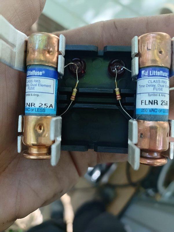 Completed first-time air conditioning and coil installation, including replacement of 25-amp Class RK5 Littelfuse fuses in the electrical disconnect and connection of refrigerant line set with service valves to the new outdoor condensing unit. All electrical connections, copper refrigerant piping, and insulation were properly installed and secured to manufacturer specifications.