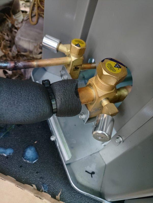 Completed first-time air conditioning and coil installation, including replacement of 25-amp Class RK5 Littelfuse fuses in the electrical disconnect and connection of refrigerant line set with service valves to the new outdoor condensing unit. All electrical connections, copper refrigerant piping, and insulation were properly installed and secured to manufacturer specifications.