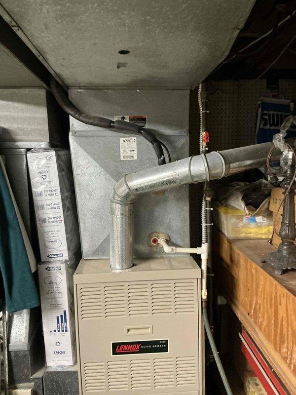 Responded to no cooling condition on residential HVAC system that failed earlier in the week. Conducted comprehensive assessment of existing Lennox furnace and air conditioning components in basement mechanical room. Evaluated system age, efficiency, and extent of failure to determine repair versus replacement options. Prepared detailed estimate for complete HVAC system replacement including new furnace, air conditioning unit, and associated ductwork modifications as needed. Documented existing equipment configuration and installation environment with photographs for estimate preparation and customer review.