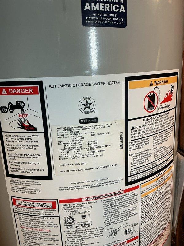 Successfully installed a new 40-gallon Bradford White water heater with 6-year manufacturer warranty, including a new ball valve and expansion tank. All copper piping connections were completed, and the unit was properly mounted and secured in the basement mechanical room. The installation meets current safety standards with appropriate warning labels visible and all components functioning as specified.