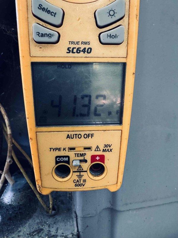 Responded to service call regarding unusual odor from unit following recent maintenance. Performed comprehensive system inspection to verify all components were properly secured and functioning correctly. Measured and recorded temperature differential across evaporator coil at 41.92 degrees, confirming adequate cooling performance and proper refrigerant charge. Checked all electrical connections, verified no components were disturbed during previous service, and confirmed unit operating within normal parameters. System found to be secure and safe for continued operation.