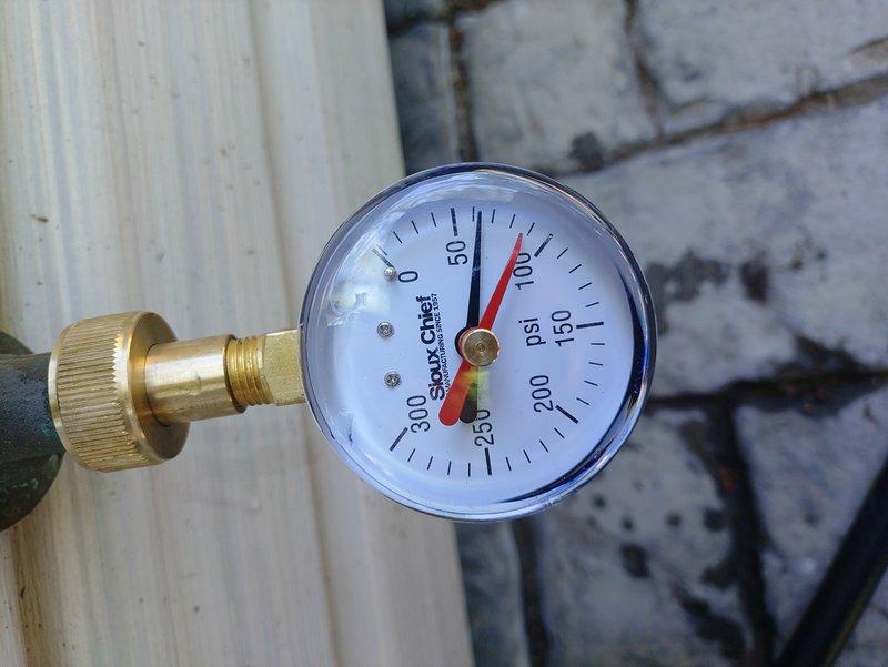 Responded to service call for loud banging noise occurring after toilet flush cycle completion. Installed new toilet as requested and diagnosed water hammer condition in supply line. Tested static water pressure using calibrated gauge, measuring approximately 125 PSI, which exceeds recommended residential range and explains hydraulic shock causing banging sounds when fill valve closes abruptly.