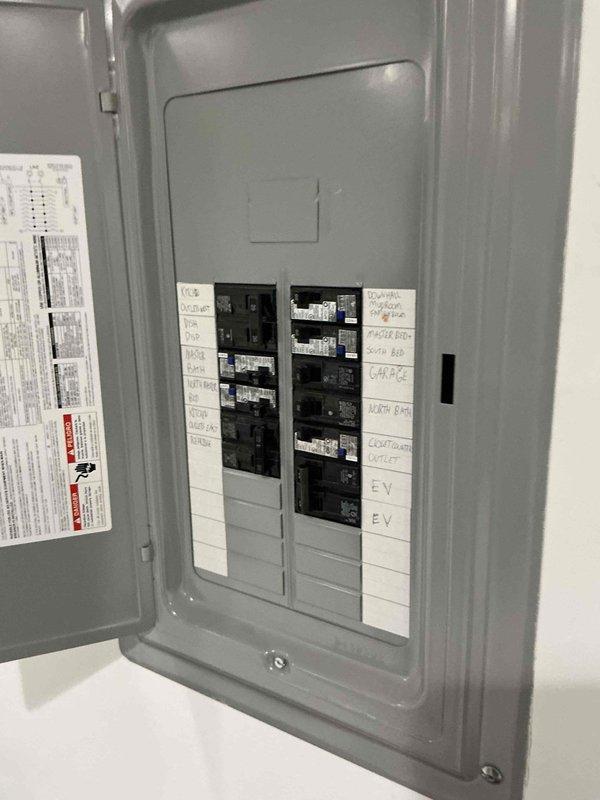 Conducted electrical site assessment for Kohler generator installation. Evaluated existing main electrical panel and subpanel configuration to determine compatibility and capacity for generator integration. Documented current breaker layout including 150A automation panel, main service breakers, and existing circuits serving HVAC systems, kitchen appliances, EV charging, and other critical loads. Photographed panel configuration and circuit labeling to support generator sizing recommendations and transfer switch specifications for Buckeye Power Sales proposal.