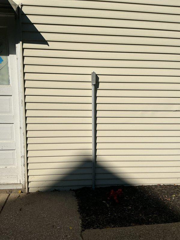 Corrected code violations in detached structure subpanel by separating improperly bonded grounds and neutrals onto individual bus bars per NEC requirements. Removed and replaced improper PVC feeder conduit on exterior, installed expansion coupling on riser, and terminated conduit into subpanel using appropriate weatherproof fittings. Installed ground rod system to properly ground detached structure and sealed unused panel knockouts to maintain enclosure integrity.