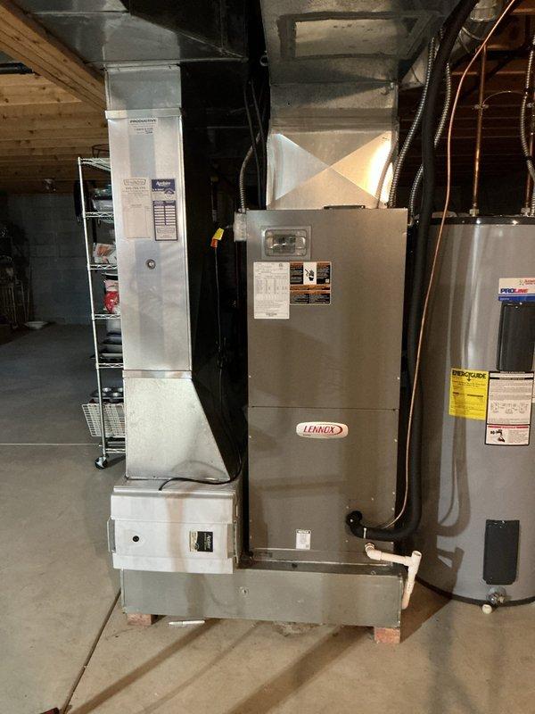 Responded to callback for electrical interference issues affecting household electronics when AC system cycles on, despite recent installation of hard start kit and capacitor. Inspected Lennox air handler electrical compartment and verified proper installation of previously installed components. Documented existing wiring configuration and capacitor connections to assess potential voltage spike or grounding concerns causing interference with TV and other electronic devices during compressor startup.
