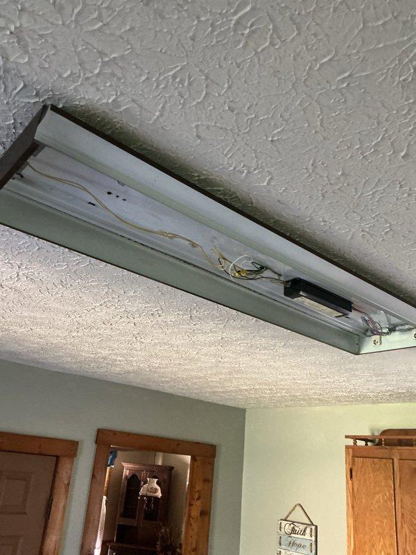 Responded to service call for GFCI outlet installation. Successfully installed three GFCI outlets as requested: two in kitchen area and one on side porch using surface-mounted conduit along wall corner with appropriate weatherproof box. Additionally addressed fluorescent light fixture that had become detached from ceiling mount in hallway, securing fixture properly and restoring safe operation.