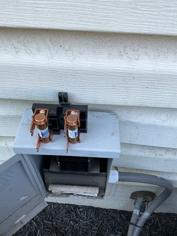 Completed routine MVP cooling maintenance visit on residential HVAC system. Performed comprehensive inspection of outdoor condensing unit including visual examination of condenser fan assembly, protective grille, and electrical disconnect box with cartridge fuses. All components found in proper working condition with no immediate service needs identified.