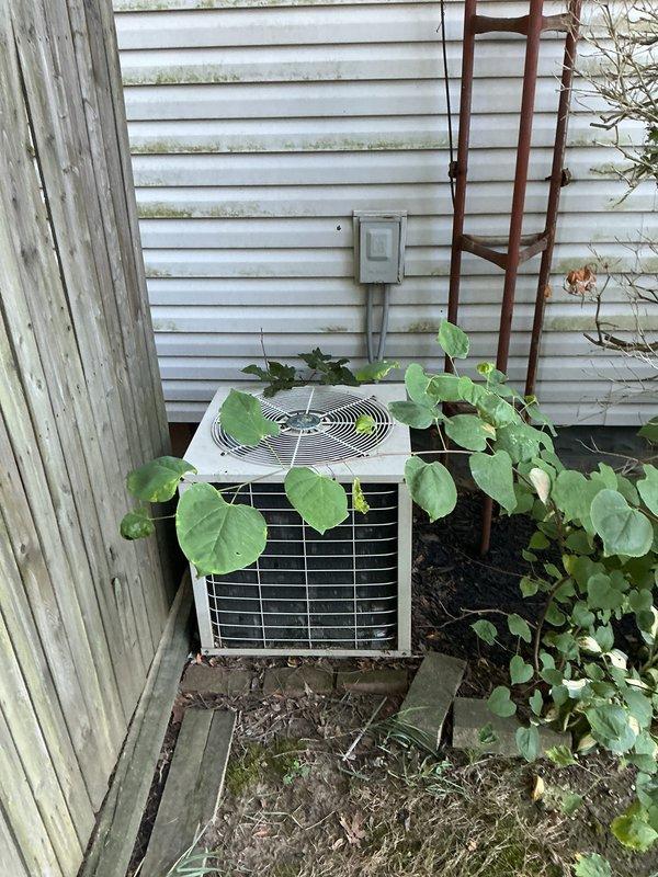 Completed full HVAC system installation including an 80% efficiency furnace in the basement mechanical room and matching air conditioning condenser unit on the exterior of the residence. The new furnace was properly positioned on the basement floor with all ductwork connections secured and routed through the ceiling joists, while the outdoor AC unit was installed against the house siding with electrical connections completed and protected. Both units were tested for proper operation and airflow to ensure the complete heating and cooling system functions as designed.