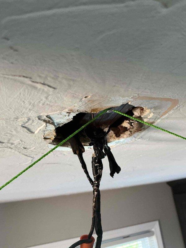Installed ceiling fan in 70+ year old home with knob and tube wiring present. Cut ceiling opening to access electrical cavity, installed new electrical box to support fan weight, and ran new wiring to replace outdated knob and tube system for safe operation. Completed all connections, patched ceiling around new fixture, and verified proper fan operation and electrical safety.
