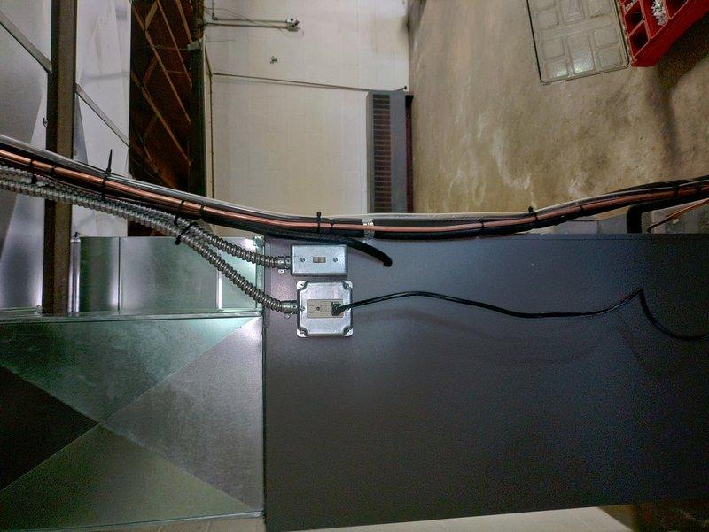 Responded to a potential circuit breaker issue requiring rework. Inspected electrical panel containing GE circuit breakers ranging from 15A to 25A, including kitchen circuit. Evaluated flexible metal conduit routing and junction box installation along HVAC ductwork system, with associated wiring secured by mounting clips. Circuit requires additional attention to complete proper installation and ensure code compliance.