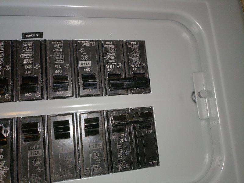 Responded to a potential circuit breaker issue requiring rework. Inspected electrical panel containing GE circuit breakers ranging from 15A to 25A, including kitchen circuit. Evaluated flexible metal conduit routing and junction box installation along HVAC ductwork system, with associated wiring secured by mounting clips. Circuit requires additional attention to complete proper installation and ensure code compliance.