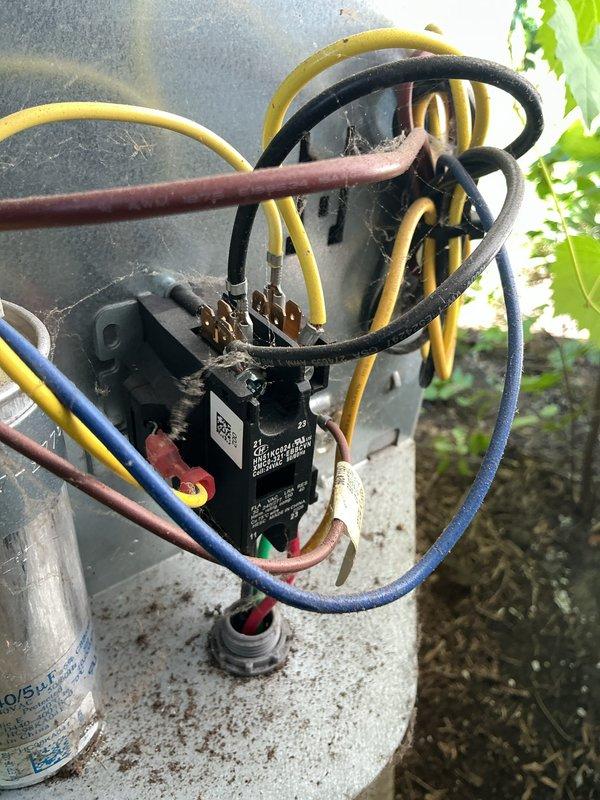 Completed MVP cooling maintenance visit on residential HVAC system. Performed standard preventive maintenance inspection of outdoor condensing unit, verifying proper operation of electrical components including contactor, capacitor, and associated wiring connections. All electrical connections found secure with no visible signs of deterioration or overheating. Documented equipment condition through photographic records showing electrical disconnect box and outdoor unit components in serviceable condition.