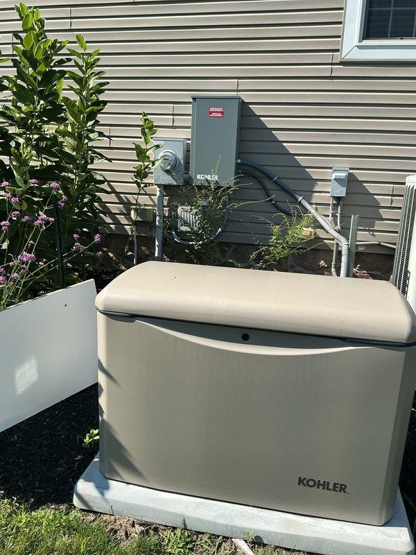 Completed electrical corrections following failed inspection on Kohler generator installation. Properly labeled disconnect per NEC 230.85, corrected neutral wire terminations to one wire per terminal per NEC 408.41, installed dedicated ground bar for equipment grounding conductors, and secured service entrance cable above the electrical panel to meet code requirements.